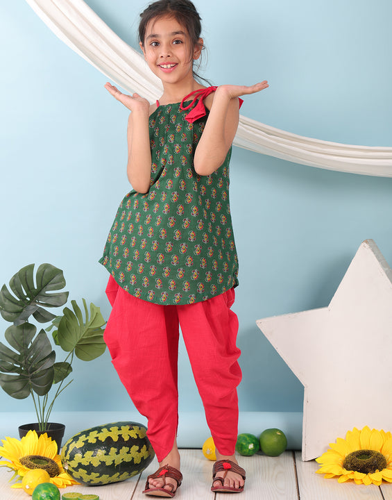 Green floral sleeveless tie on Kurti with Red Dhoti