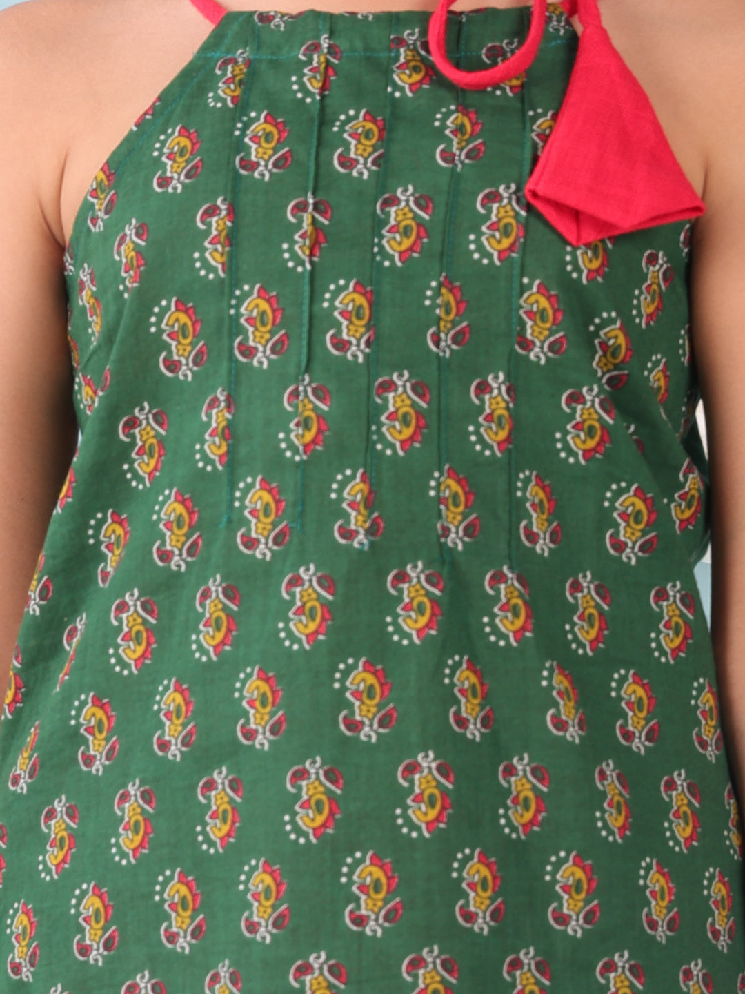 Green floral sleeveless tie on Kurti with Red Dhoti