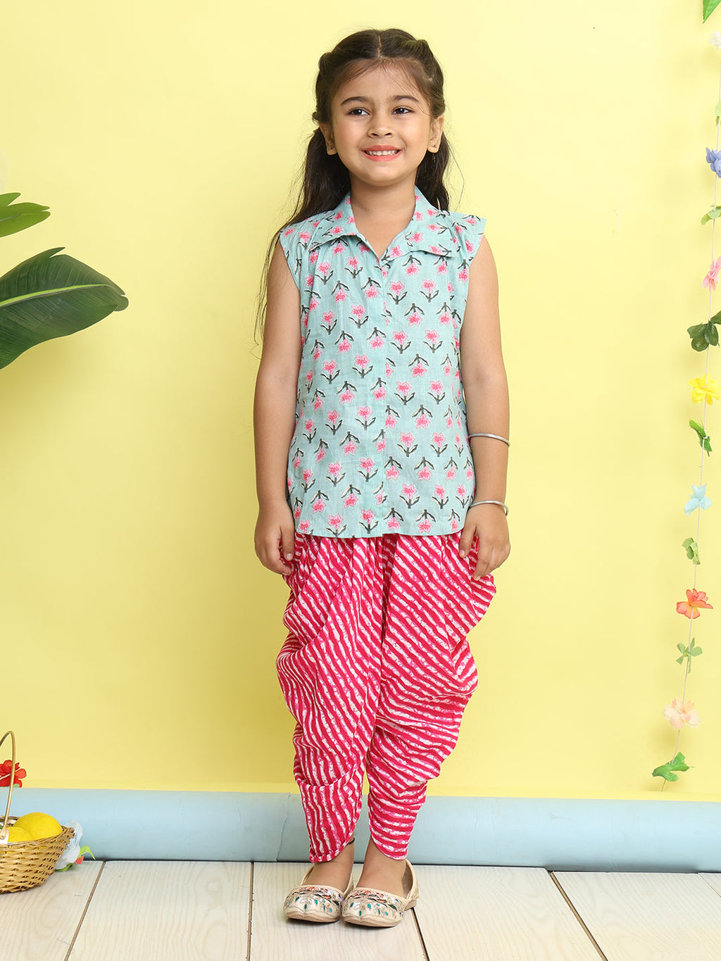 Green Floral Printed sleeveless Kurti  paired with Pink lehriya Dhoti