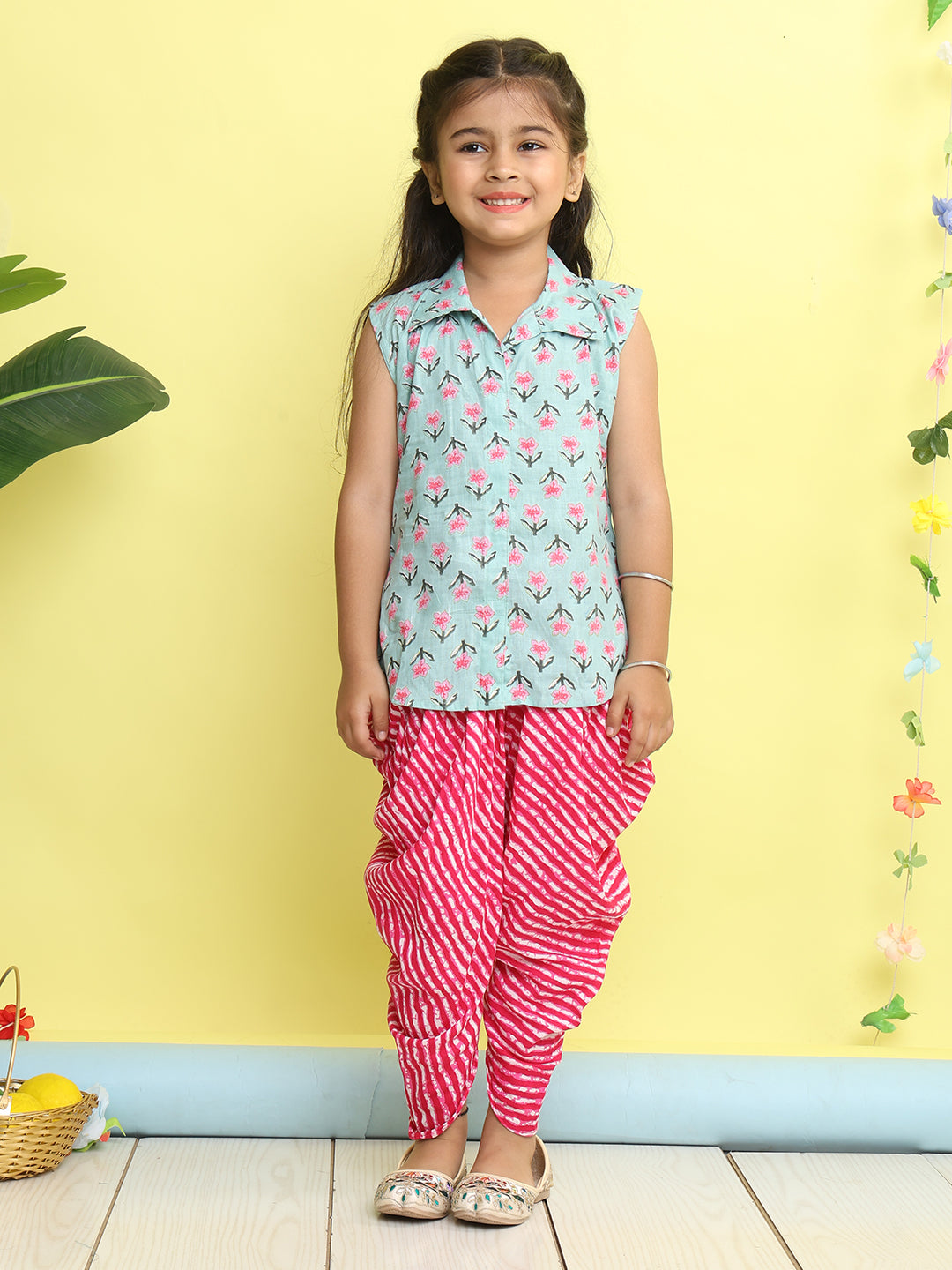 Green Floral Printed sleeveless Kurti  paired with Pink lehriya Dhoti