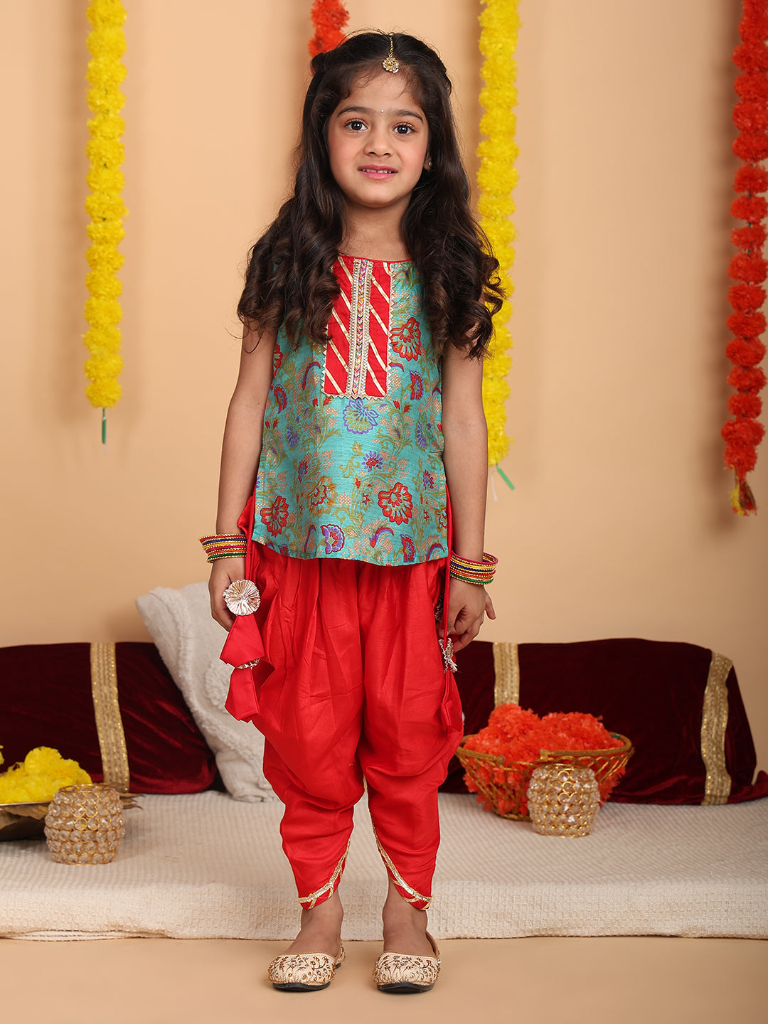 Green printed sleeveless kurti with Red dhoti