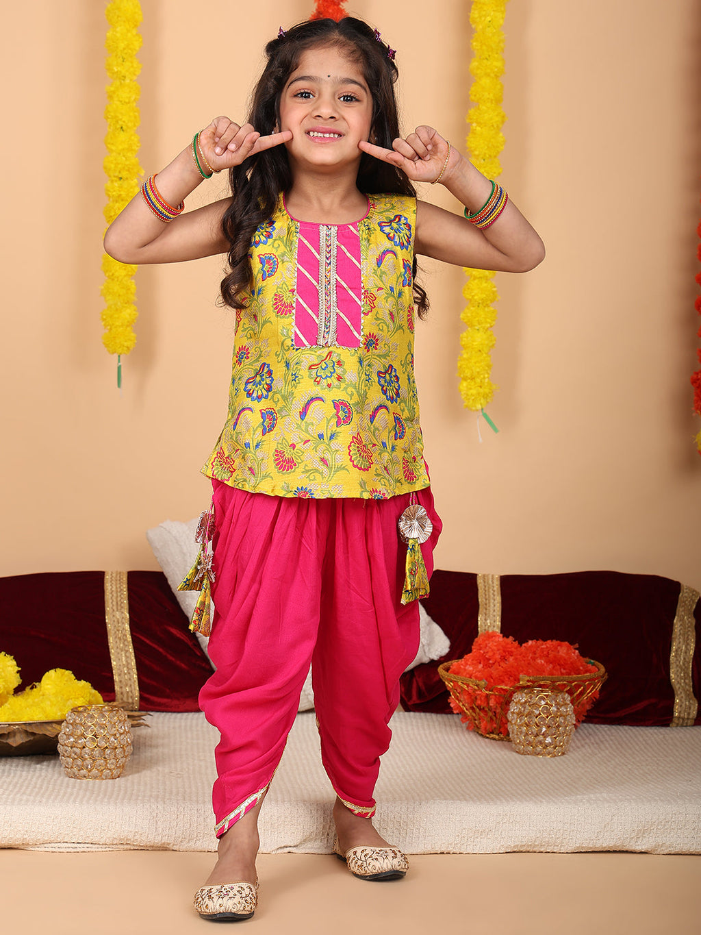 Yellow printed sleeveless kurti with Pink dhoti