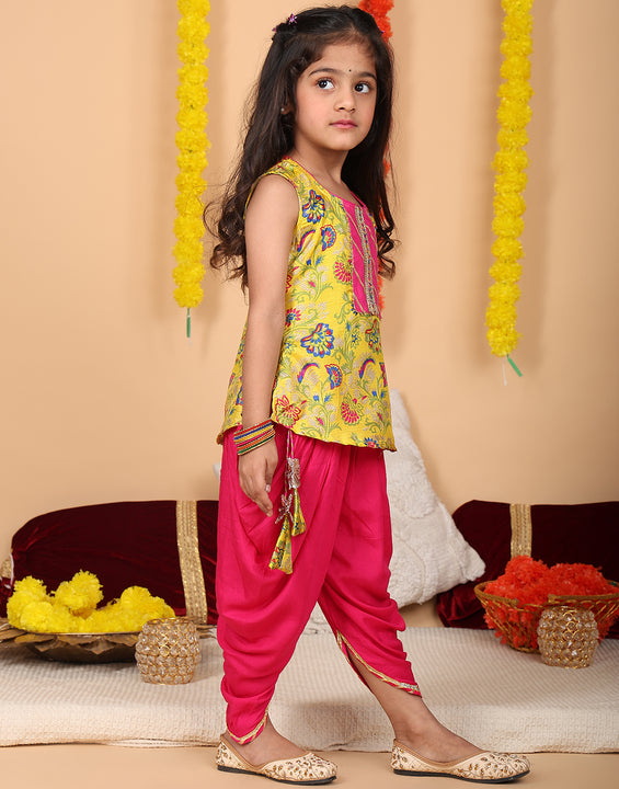 Yellow printed sleeveless kurti with Pink dhoti