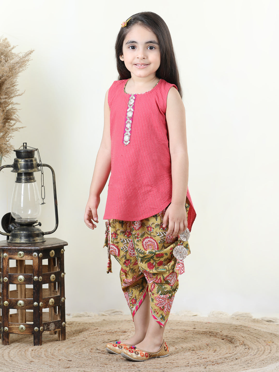 Yellow Floral printed dhoti paired with Peach katha Kurti with a lace border at the neckline
