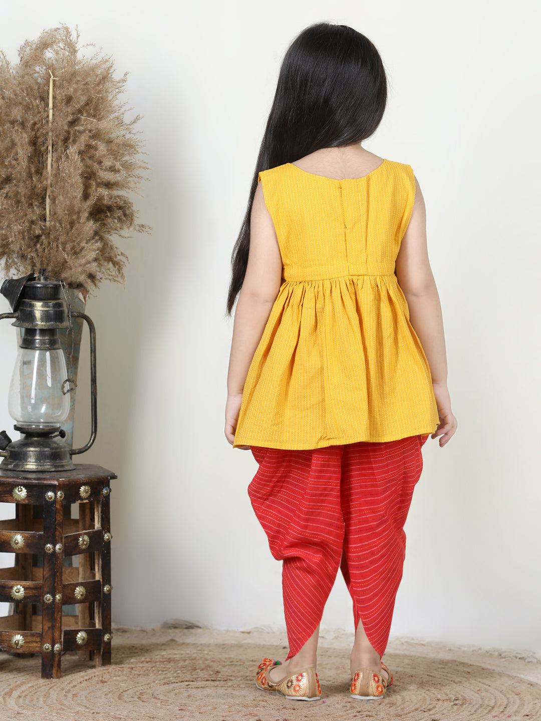 Yellow Embroidered kurti paired with dhoti