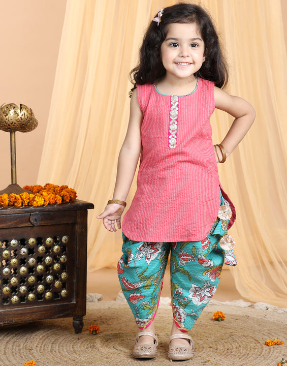 Floral printed dhoti paired with Peach katha Kurti with a lace border at the neckline