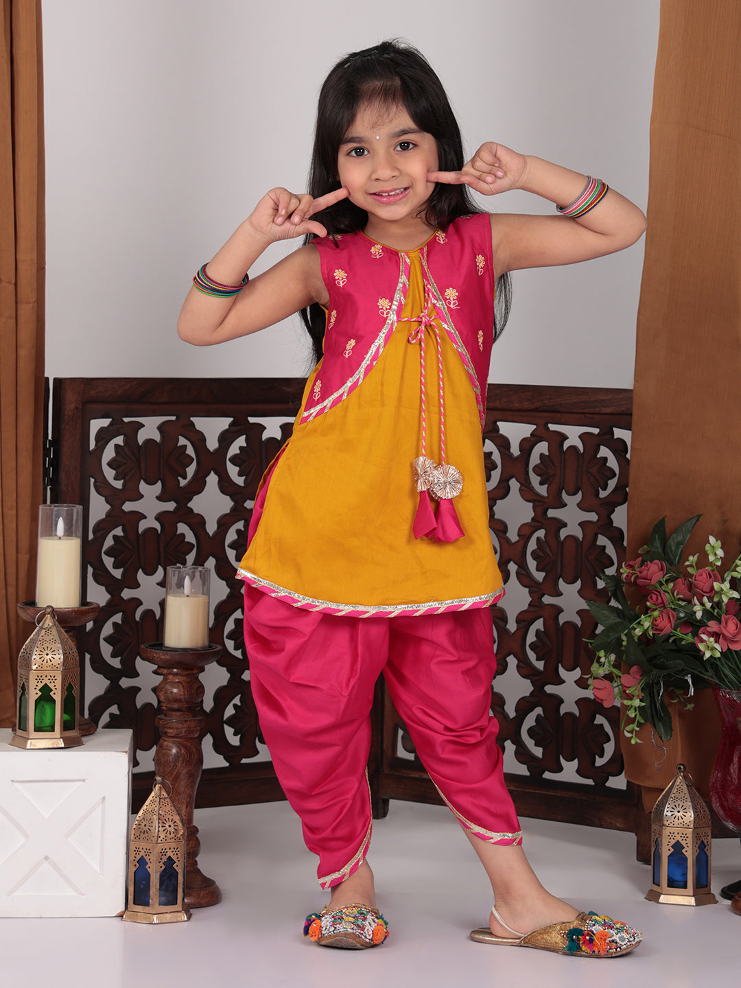 Yellow Kurti with pink embroidered attached jacket  and dhoti