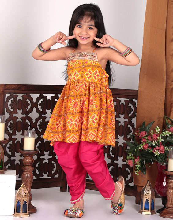 Yellow sleeveless kurti with pink dhoti