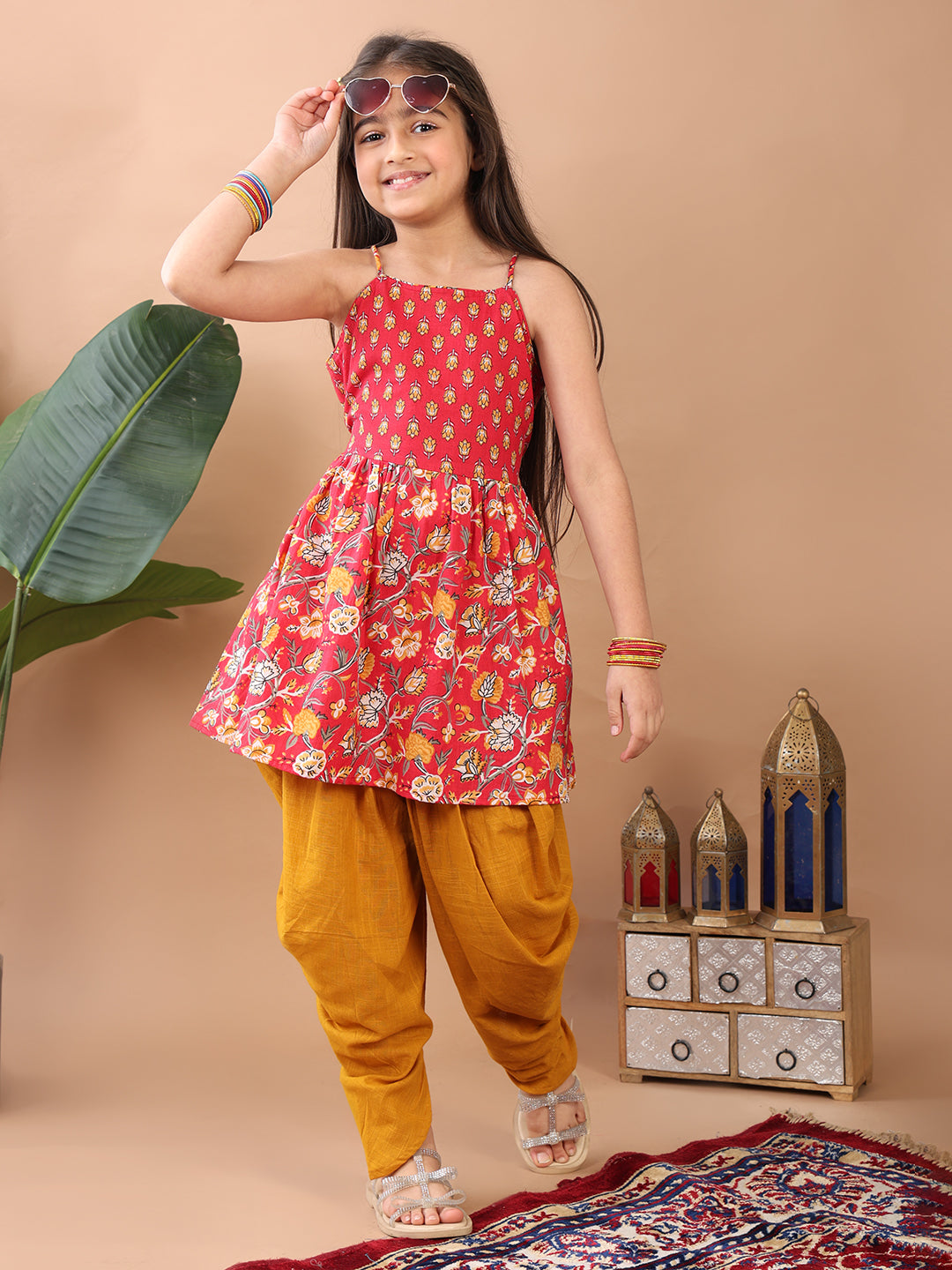 Red Floral  printed sleeveless Kurti  paired with Yellow Dhoti