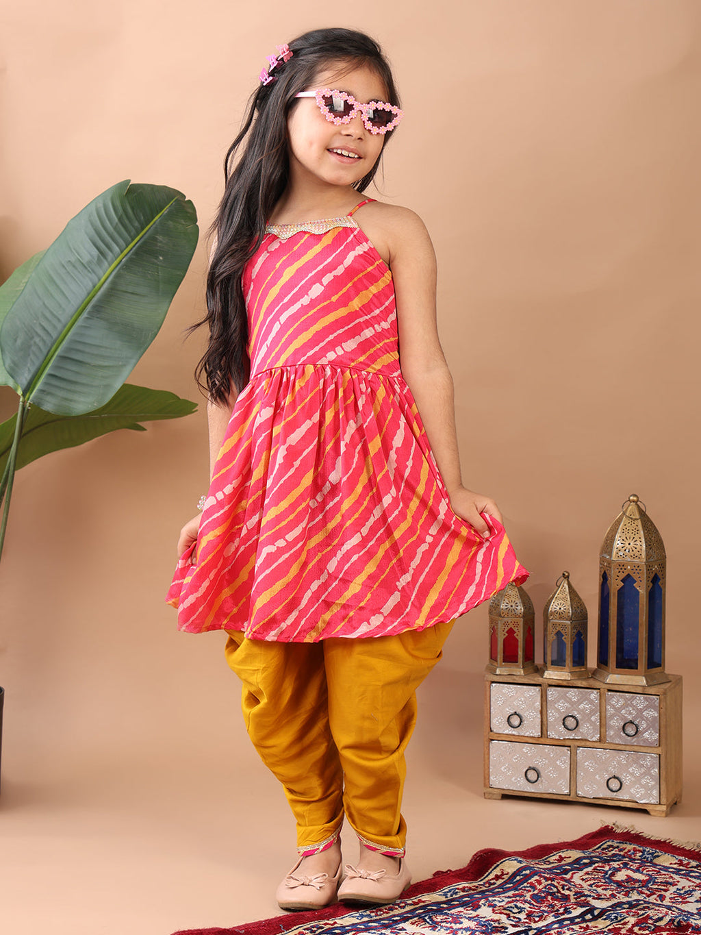 Pink Lehriya printed sleeveless Kurti  paired with Yellow Dhoti