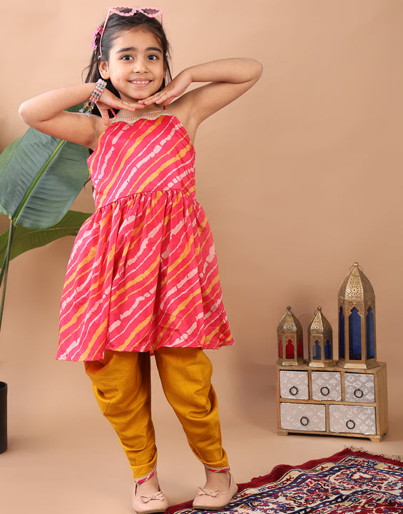 Pink Lehriya printed sleeveless Kurti  paired with Yellow Dhoti