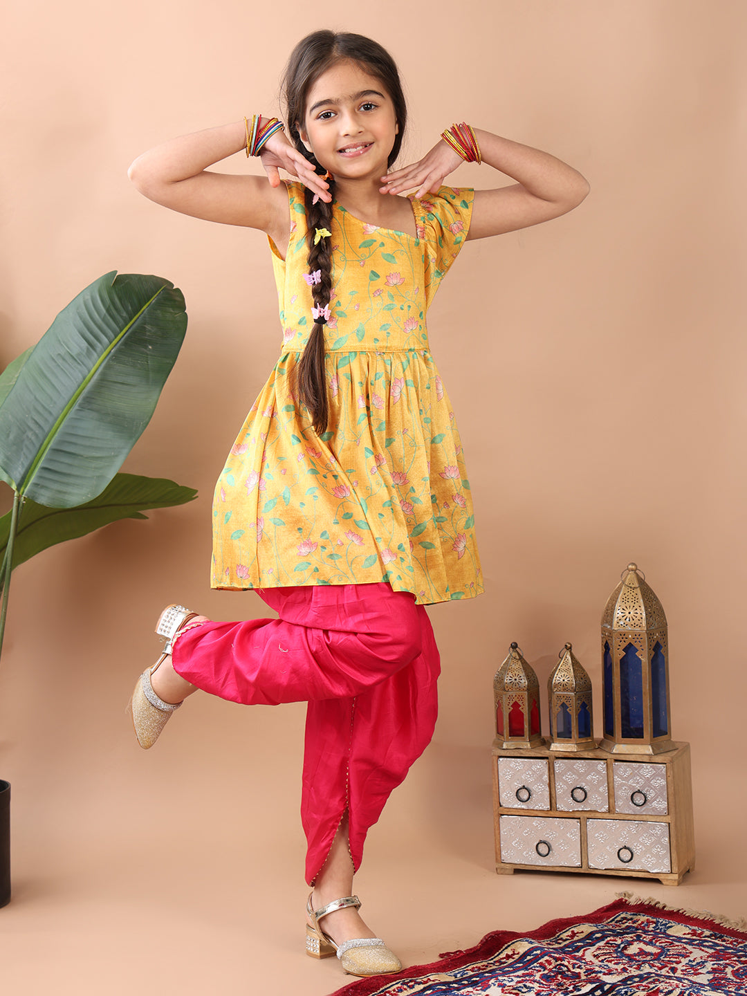 Yellow Lotus  printed sleeveless Kurti  paired with Pink Dhoti