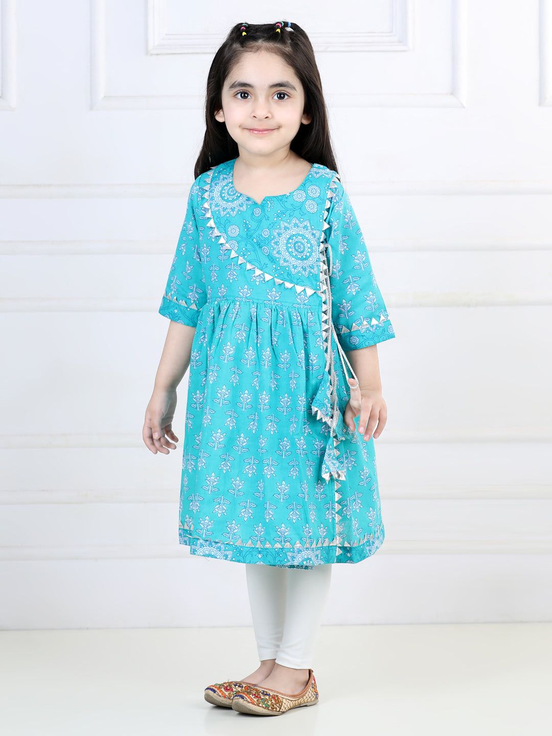 Blue printed angrakha style kurti with white leggings