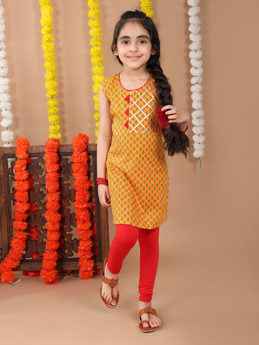 Yellow sleeveless cotton  kurti with Red leggings