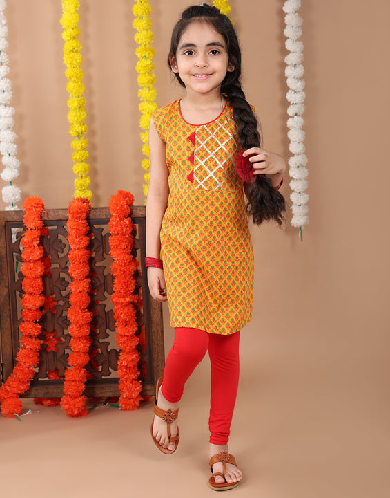 Yellow sleeveless cotton  kurti with Red leggings