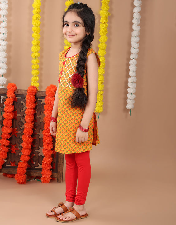 Yellow sleeveless cotton  kurti with Red leggings