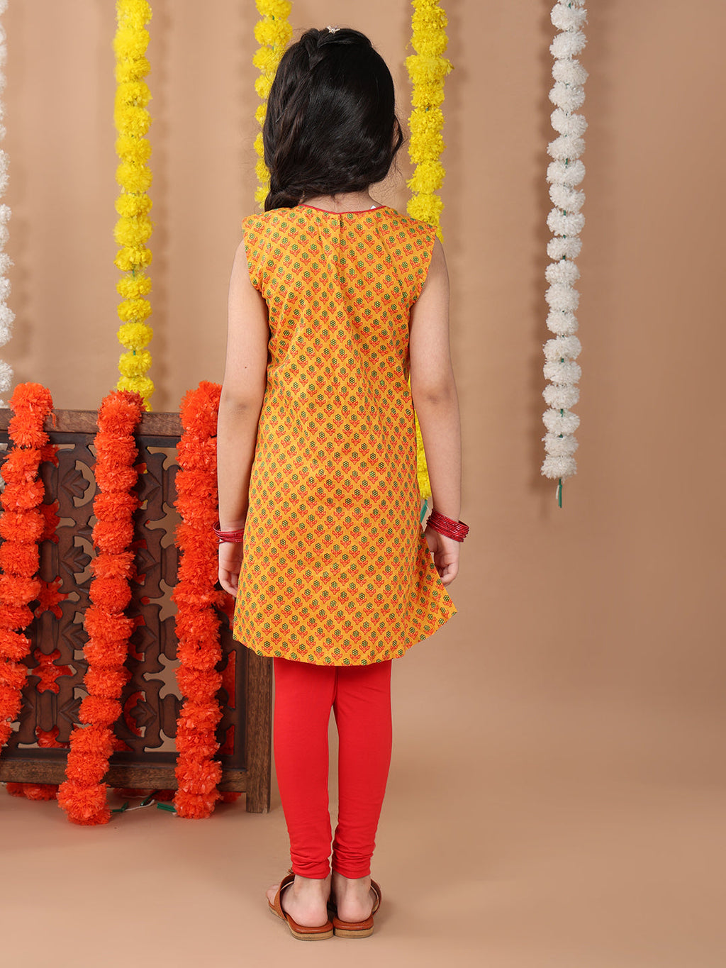 Yellow sleeveless cotton  kurti with Red leggings