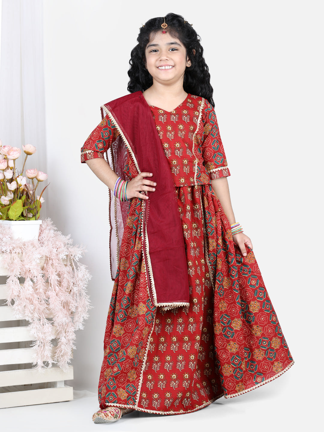 Red motif printed lace embellished top with lehenga and dupatta