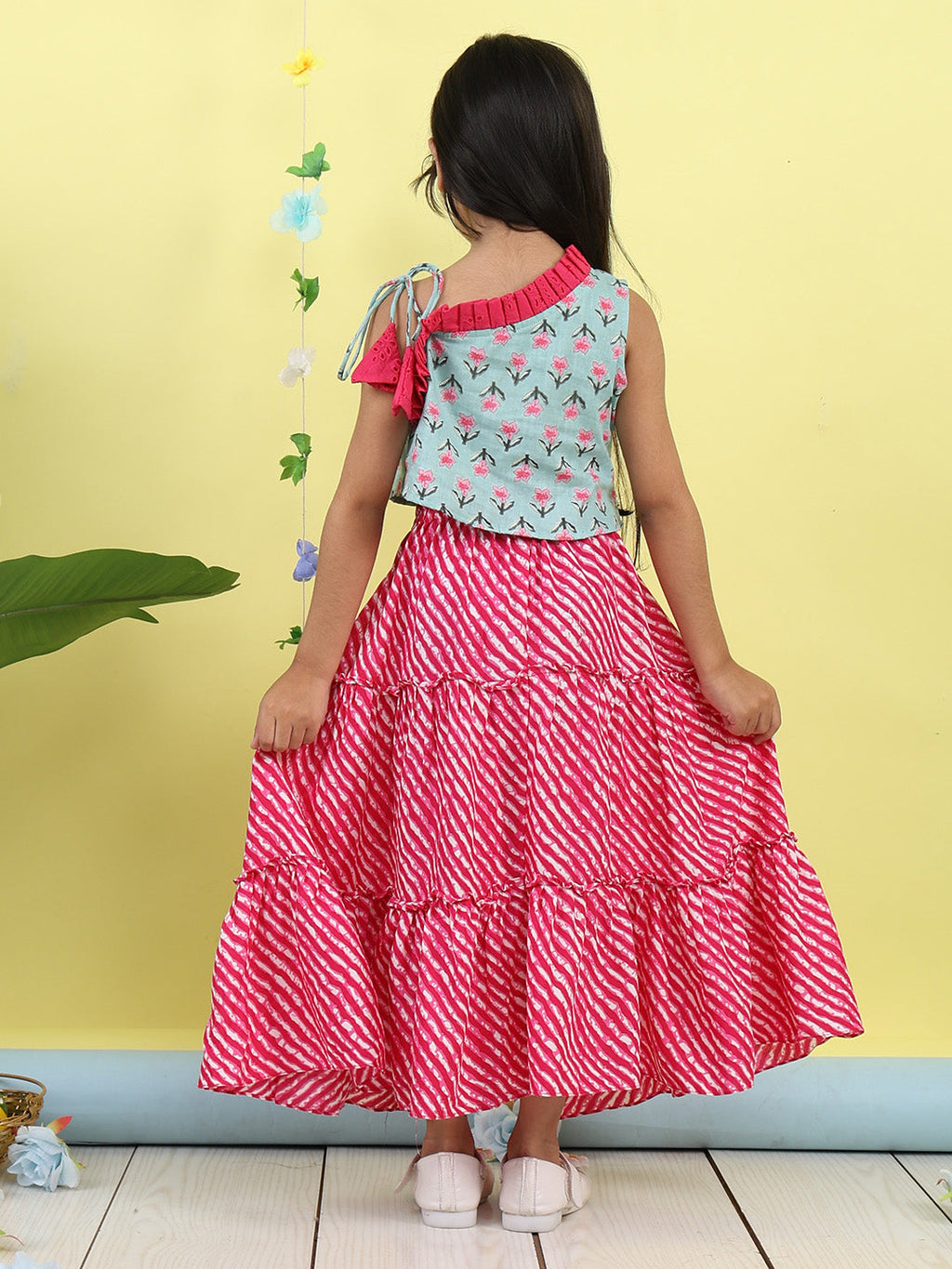 Green sleeveless floral printed top with Pink Lehriya Skirt