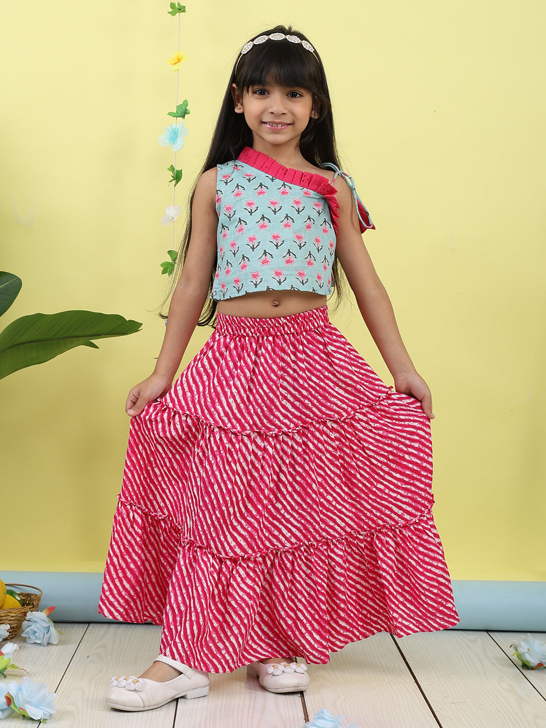 Green sleeveless floral printed top with Pink Lehriya Skirt