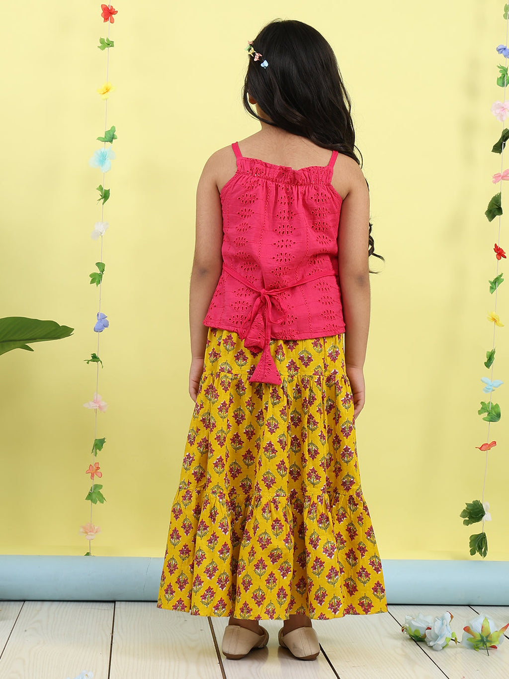 Pink sleeveless tie on hakoba top with Yellow floral printed Skirt