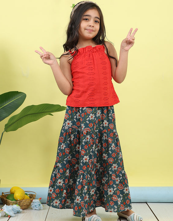 Red sleeveless tie on hakoba top with blue floral printed Skirt