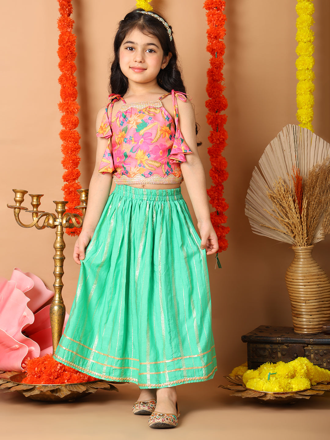 Pink Printed sleeveless top with Green golden lehenga