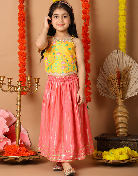 Yellow Printed sleeveless top with pink golden lehenga