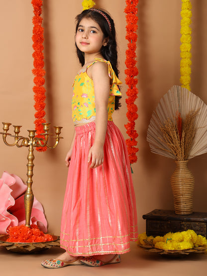 Yellow Printed sleeveless top with pink golden lehenga