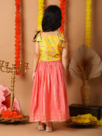 Yellow Printed sleeveless top with pink golden lehenga
