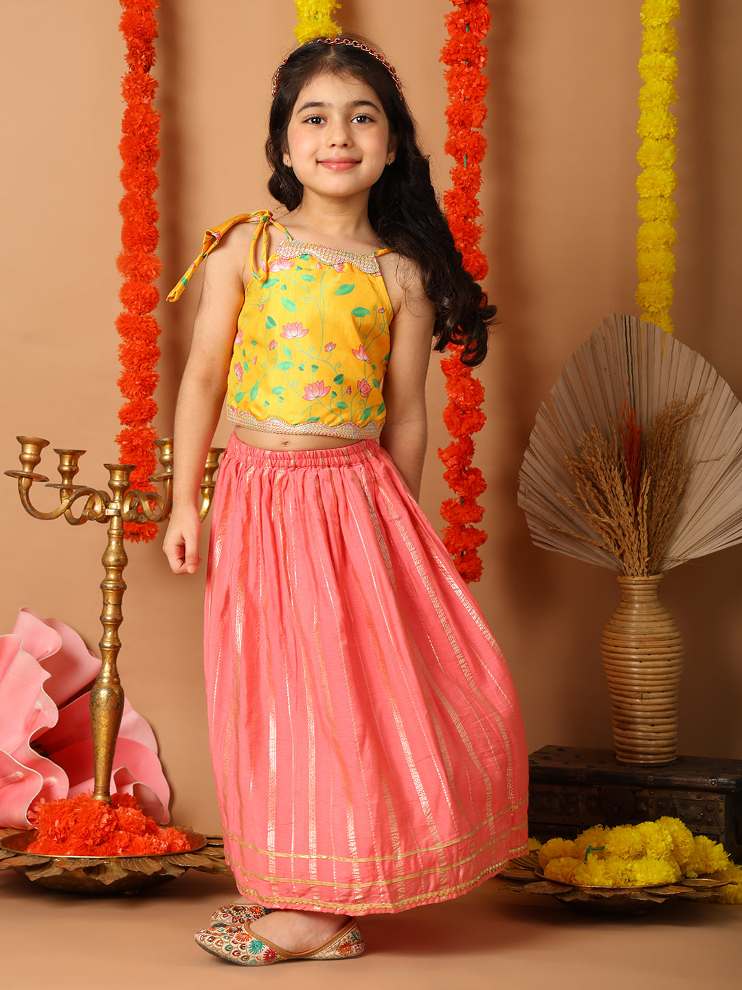 Yellow Printed sleeveless top with pink golden lehenga