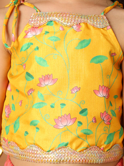 Yellow Printed sleeveless top with pink golden lehenga