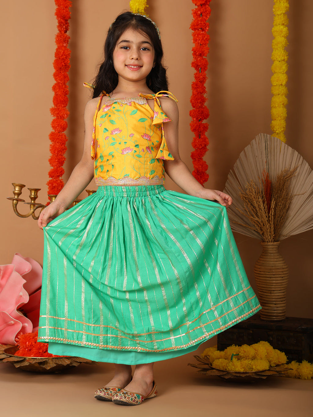 Yellow Printed sleeveless top with Green golden lehenga
