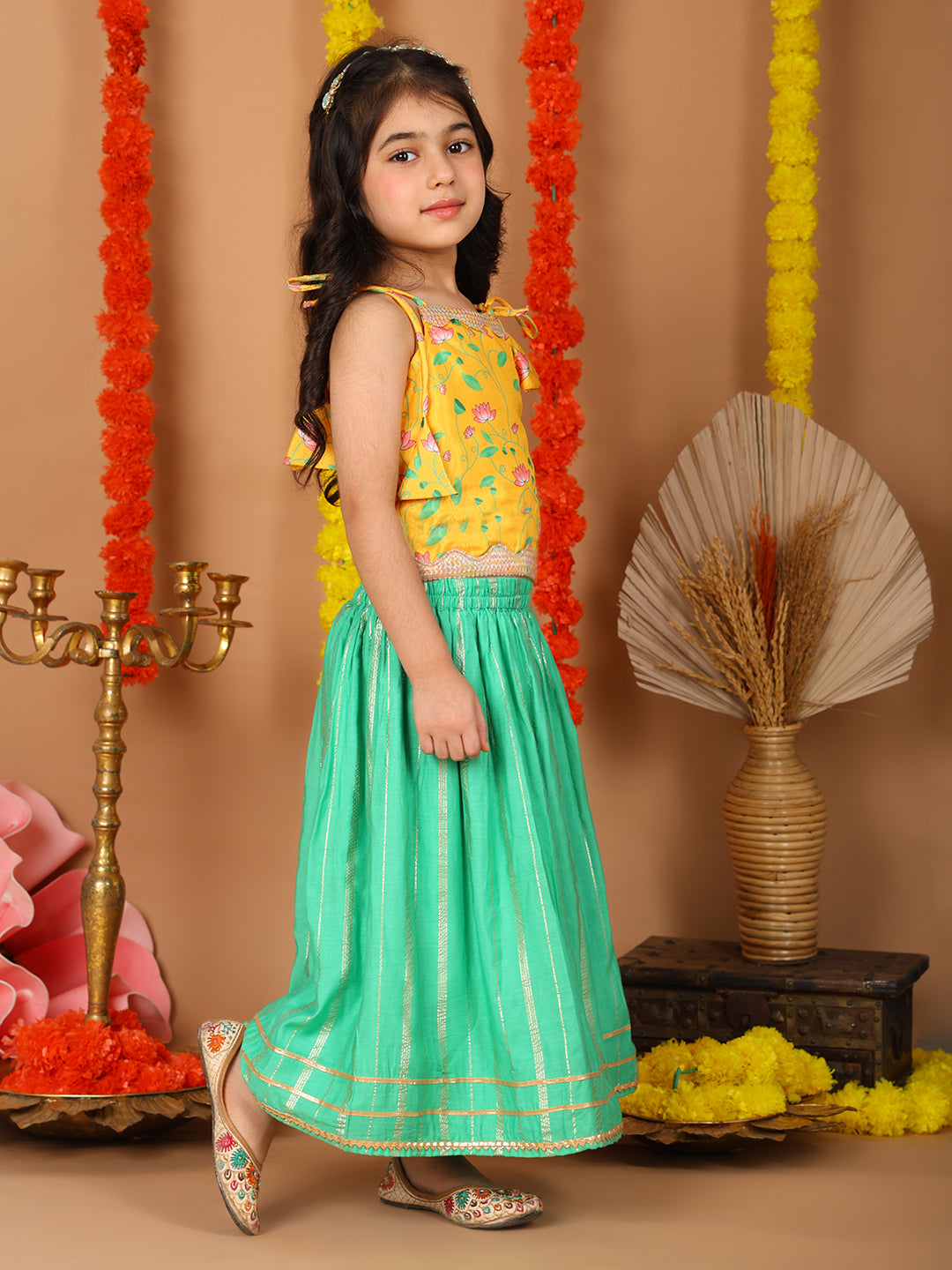 Yellow Printed sleeveless top with Green golden lehenga