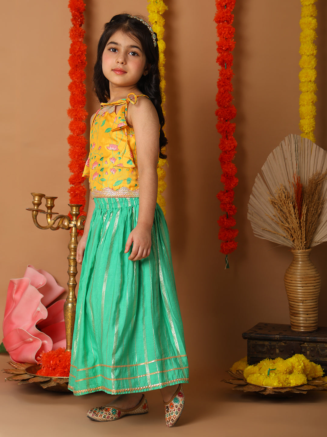 Yellow Printed sleeveless top with Green golden lehenga