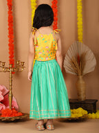 Yellow Printed sleeveless top with Green golden lehenga