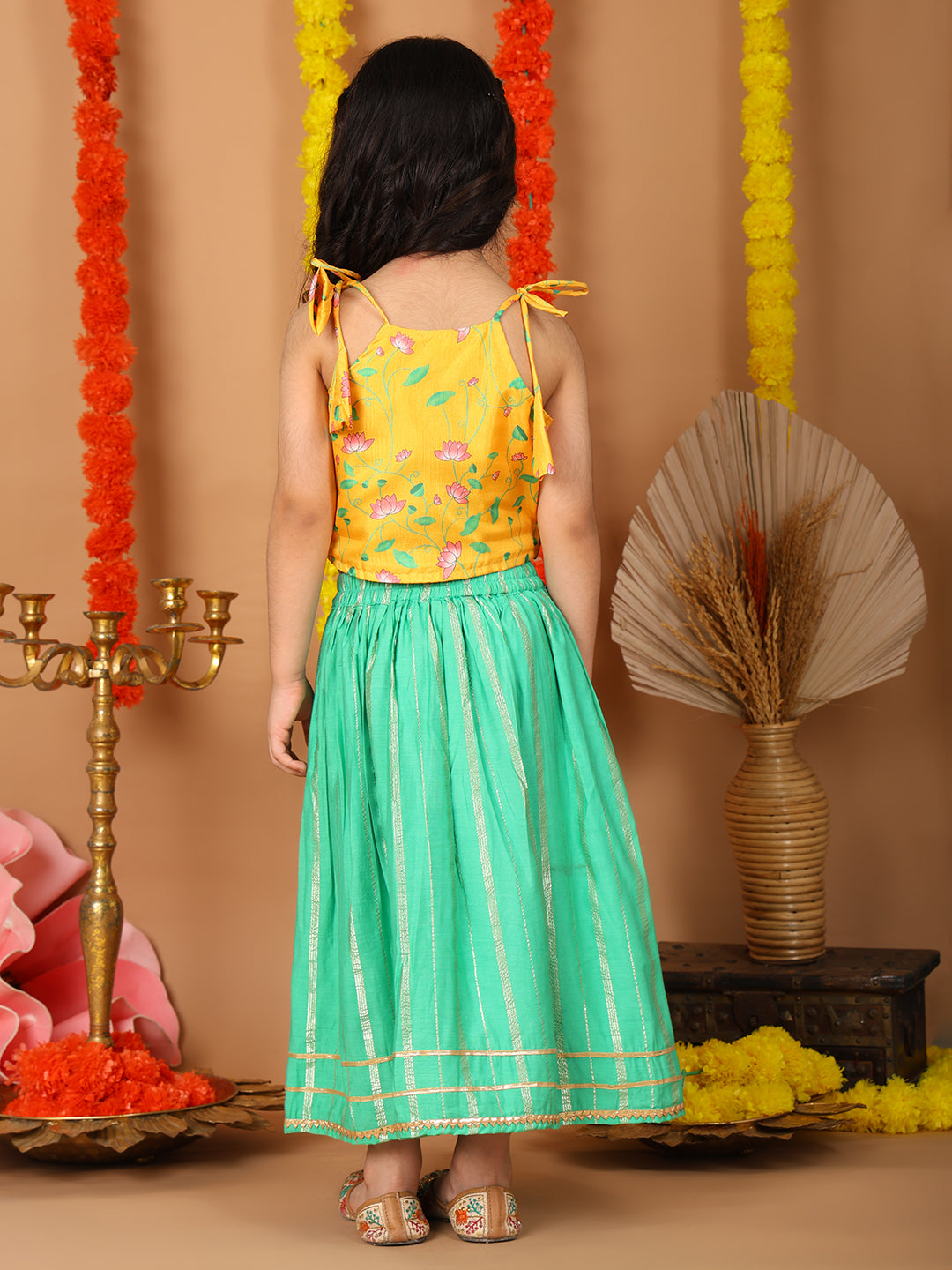 Yellow Printed sleeveless top with Green golden lehenga