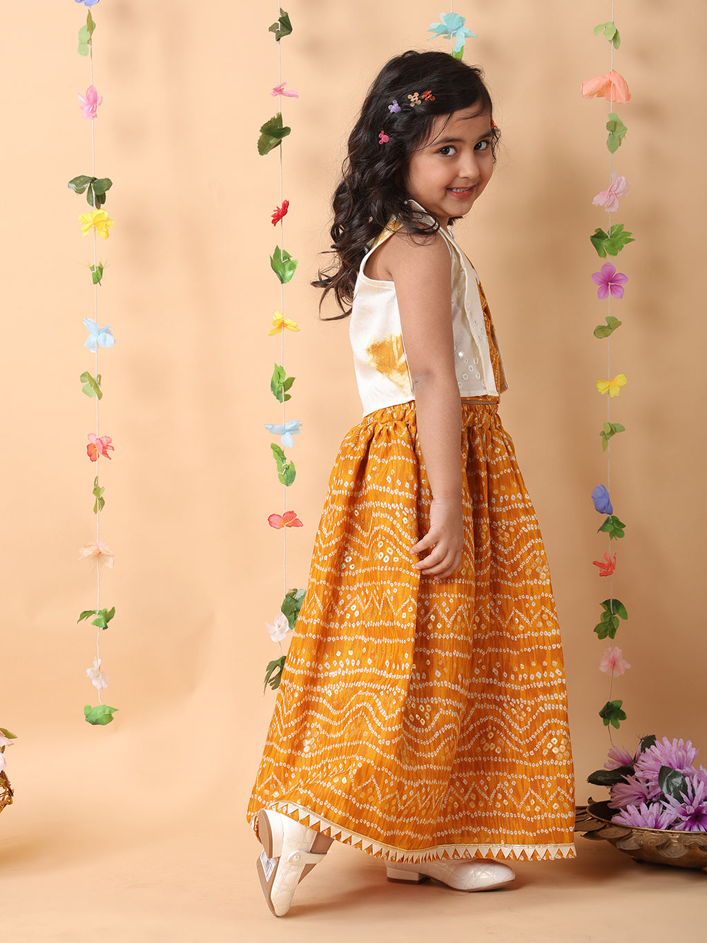 Yellow bandhani  printed  sleeveless lehenga set with mirror work jacket
