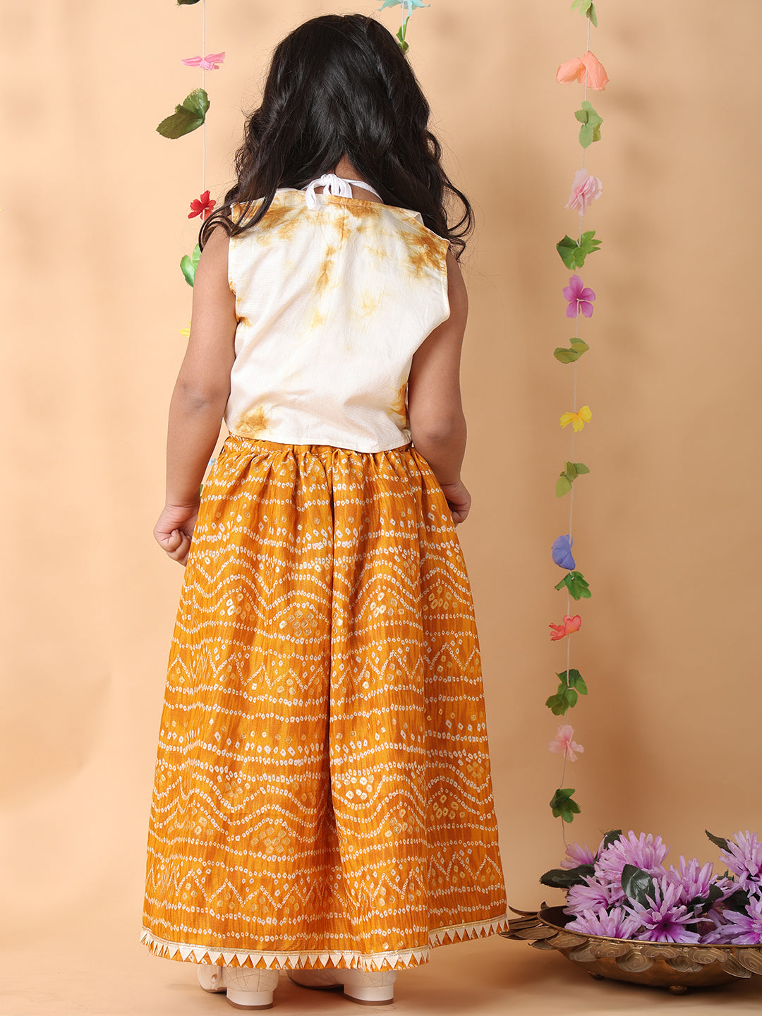 Yellow bandhani  printed  sleeveless lehenga set with mirror work jacket