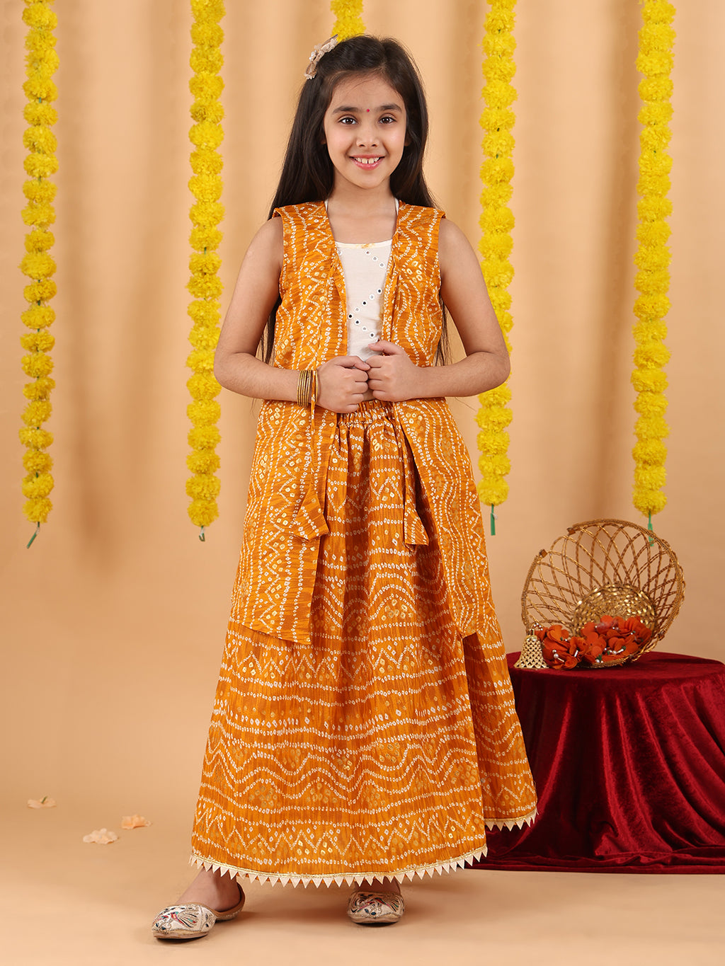 Yellow bandhani  printed lehenga with mirror work top and bandhani long jacket