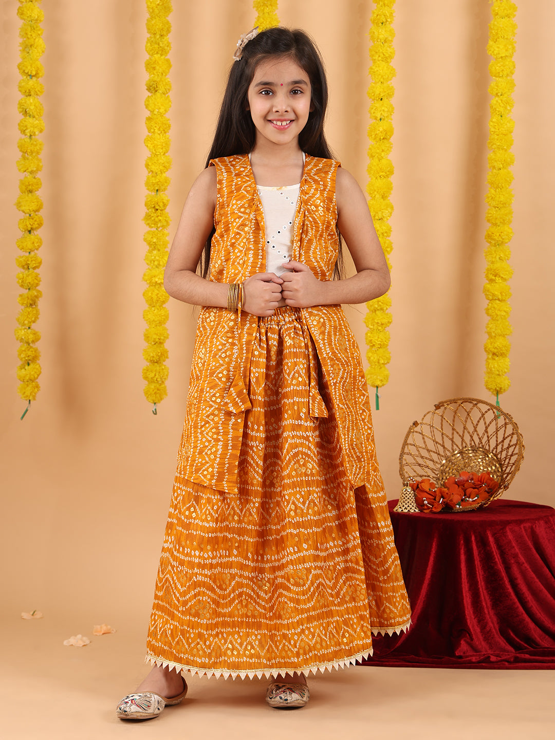 Yellow bandhani  printed lehenga with mirror work top and bandhani long jacket