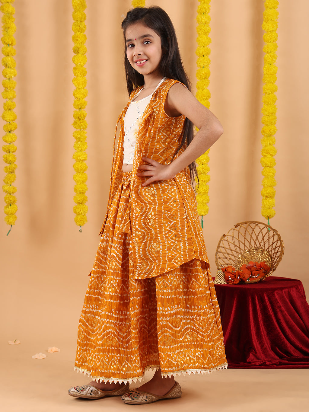 Yellow bandhani  printed lehenga with mirror work top and bandhani long jacket