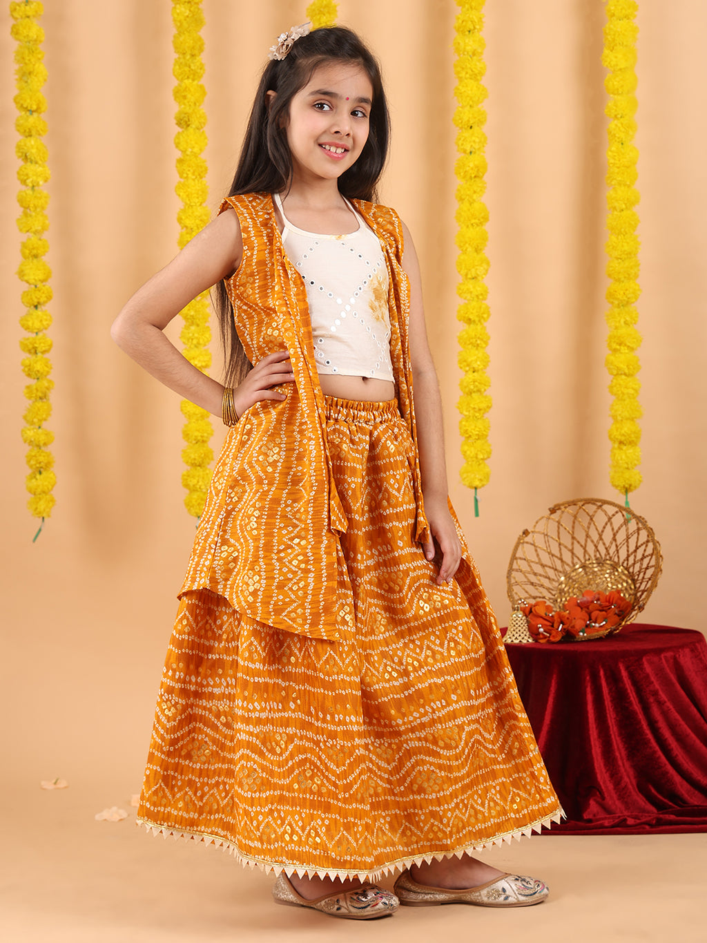 Yellow bandhani  printed lehenga with mirror work top and bandhani long jacket