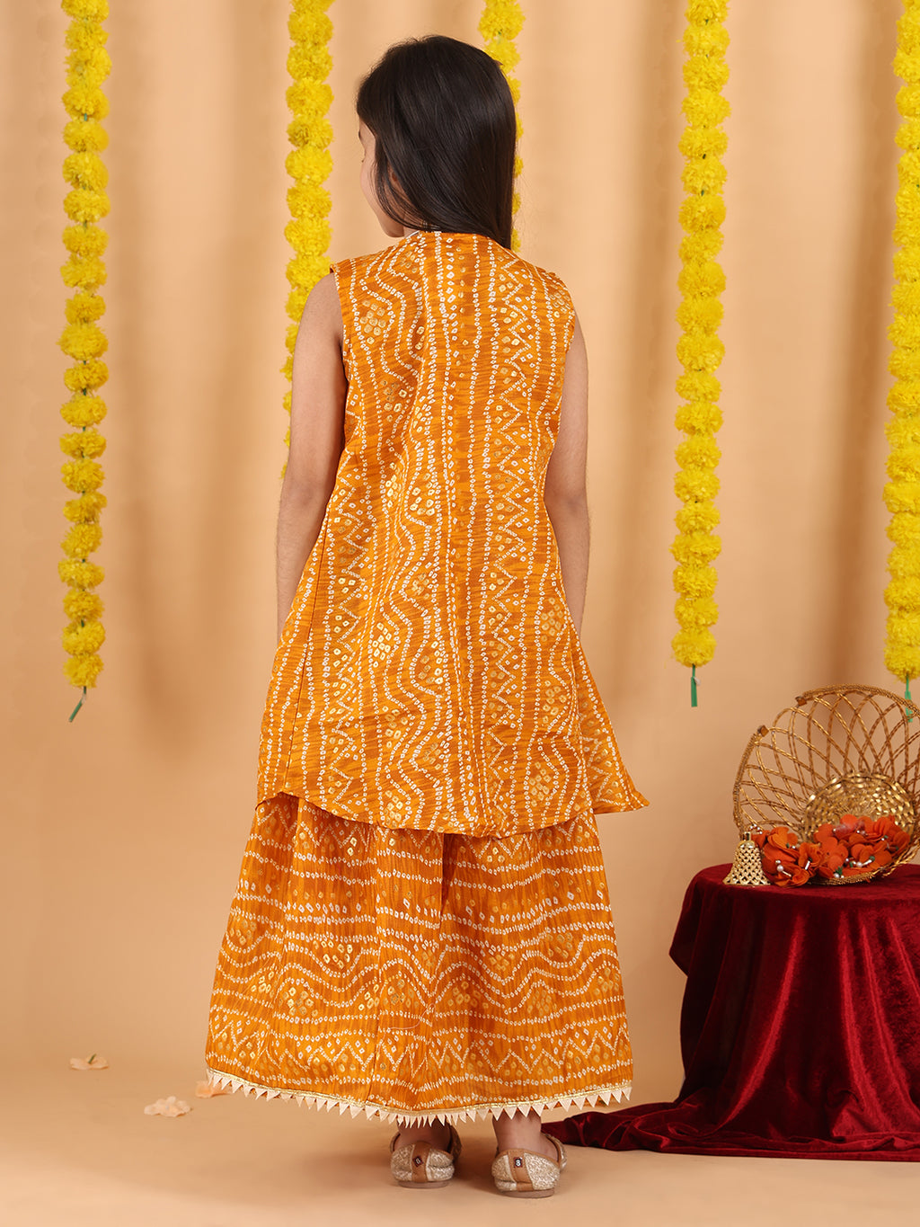 Yellow bandhani  printed lehenga with mirror work top and bandhani long jacket