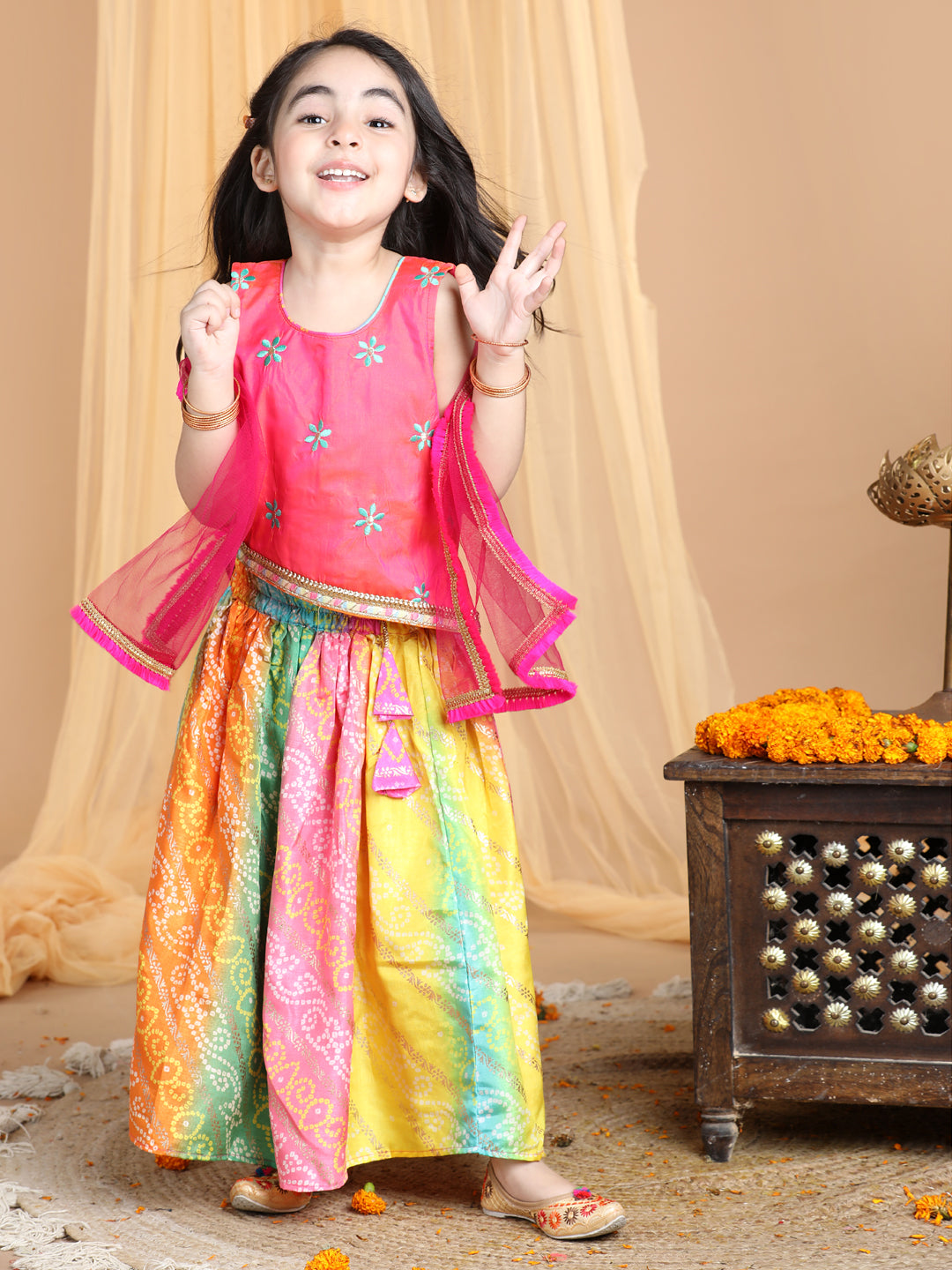 Pink Top with multi color gold printed lehenga and dupatta