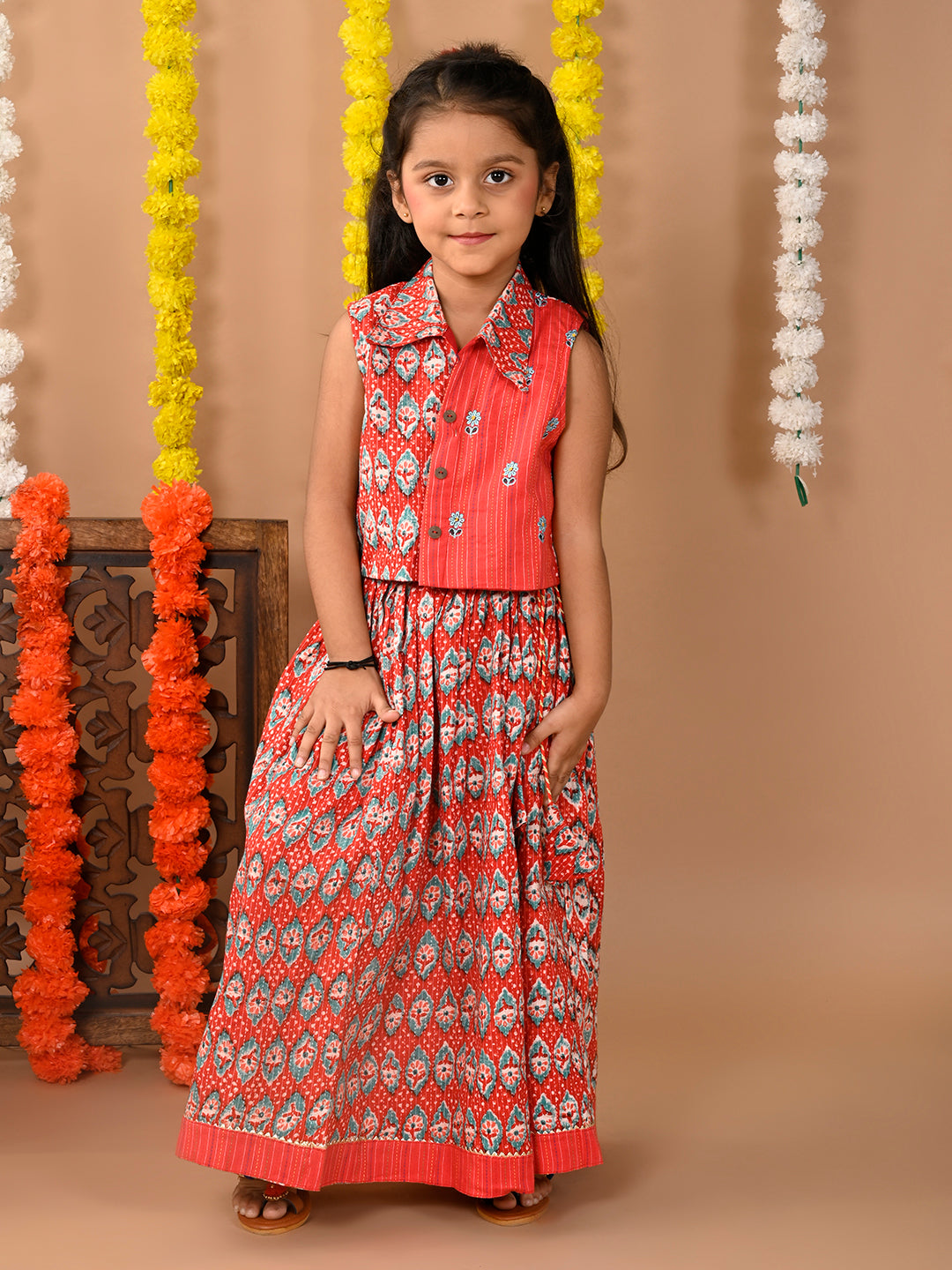 Red Lehenga with sleeveless collared embroidered top