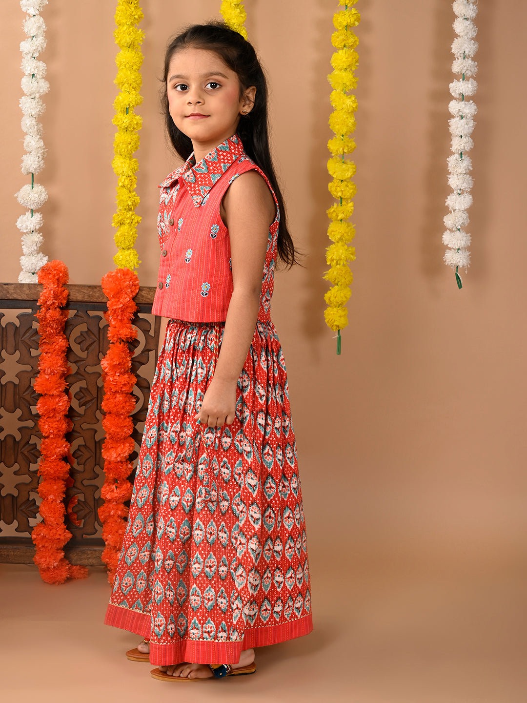 Red Lehenga with sleeveless collared embroidered top