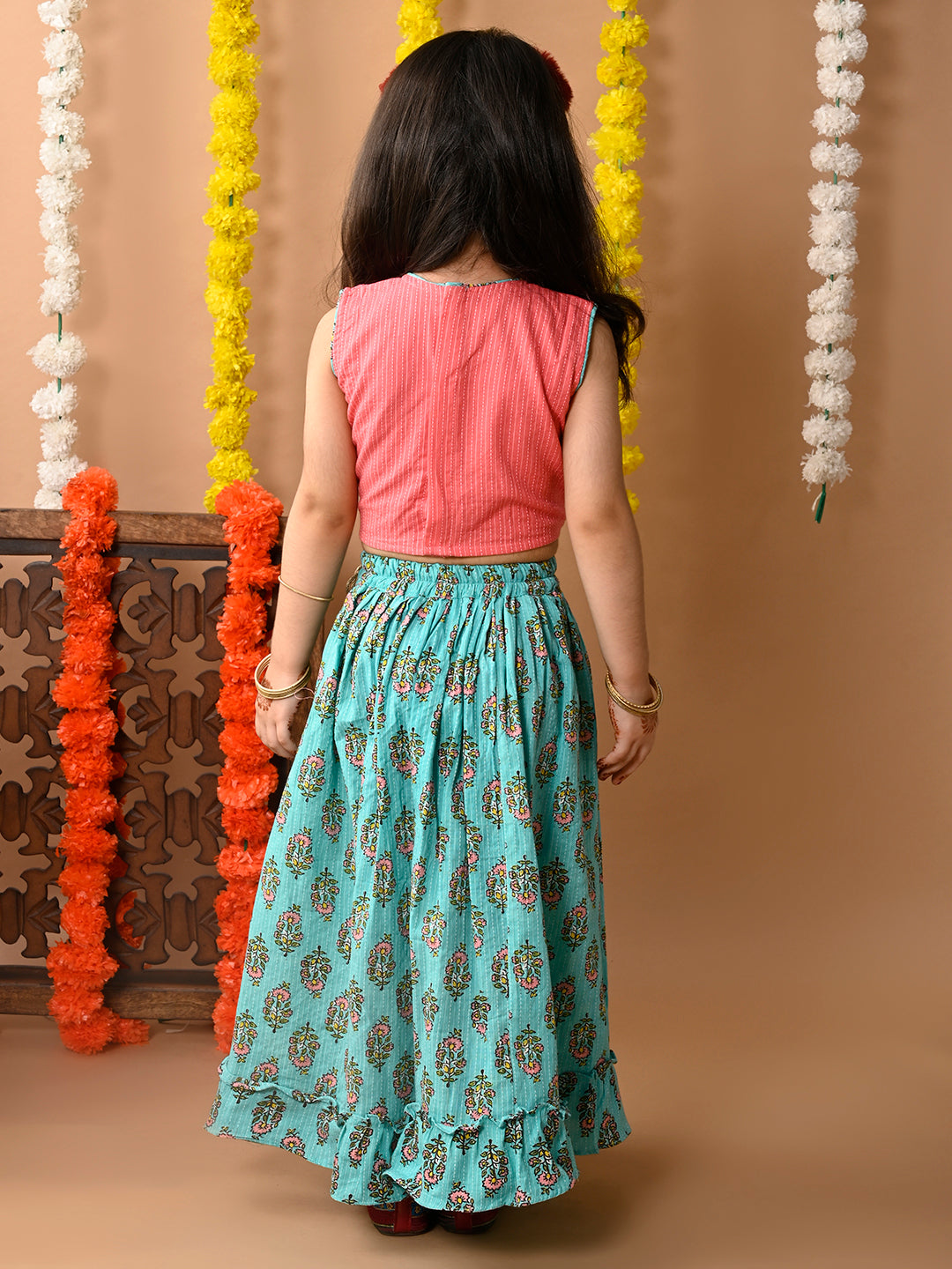 Green Cotton printed Lehenga with Peach sleeveless embroidered top