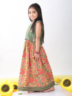 Green sleeveless embroidered blouse paired with printed lehenga