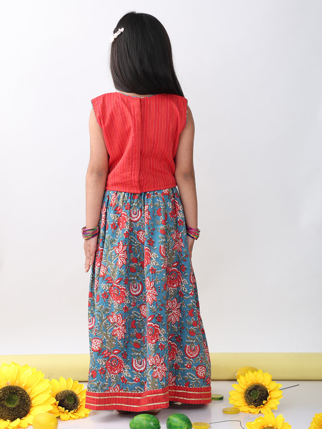 Red sleeveless embroidered blouse paired with printed lehenga- Red Blue